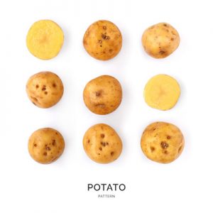 Seamless pattern with potatoes. Vegetables abstract background. Potatoes on the white background.