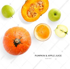 Creative layout made of pumpkin and apple juice. Flat lay. Food concept. Pumpkin and apple on the white background.
