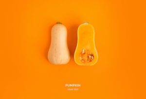 Creative layout made of pumpkin on the orange background. Flat lay. Food concept.
