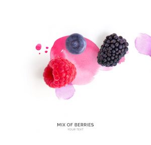 Creative layout made of raspberry, blueberry and blackberry on the watercolor background. Flat lay. Food concept.