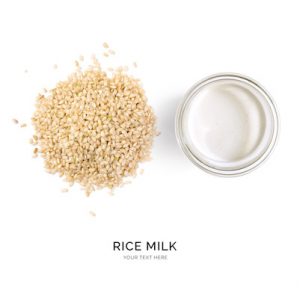 Creative layout made of rice milk on white background. Flat lay. Food concept.