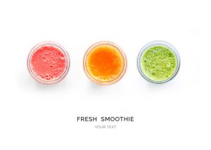 Creative layout made of smoothies. Flat lay. Food concept. Smoothies on the white background.