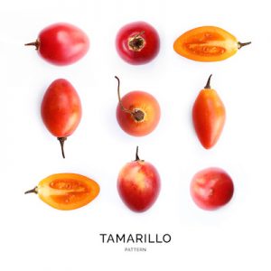 Seamless pattern with tamarillo on the white background.. Flat lay. Food concept.