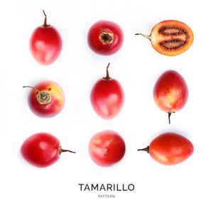 Seamless pattern with tamarillo on the white background. Flat lay. Food concept.