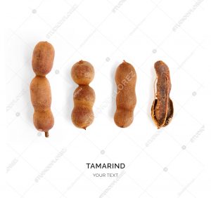 Creative layout made of tamarind. Flat lay. Food concept. Tamarind on the white background.