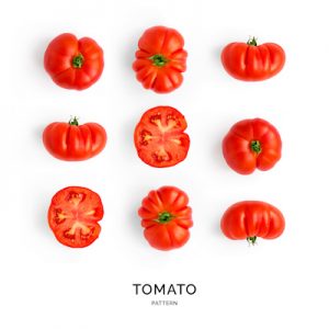 Seamless pattern with tomatoes. Abstract background. Tomato on the white background.