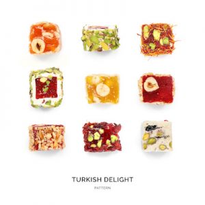 Seamless pattern with lokum. Sweets abstract background. Turkish delights on the white background.