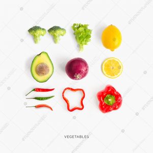 Creative layout made of avocado, red pepper, chili pepper, broccoli, lettuce, onion and lemon. Flat lay. Food concept.