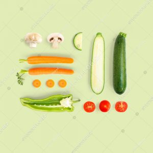 Creative layout made of champignon, carrot, tomato and zucchini. Flat lay. Food concept.