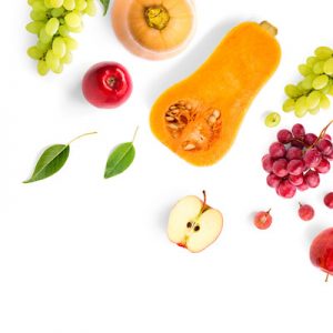 Creative layout made of green and red grape, Fruits and vegetable on the white background.