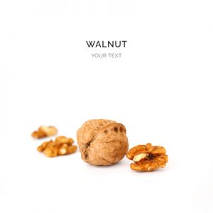 Creative layout made of walnut on the white background. Flat lay. Food concept.