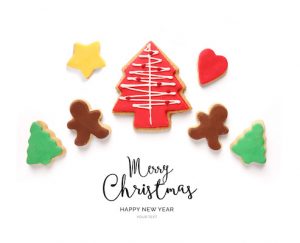 Creative happy new year card made of christmas tree cookie on the white background.  Christmas tree , top view, festive greeting card.